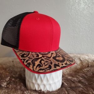 Ball cap with hand-sewn leather patch on brim